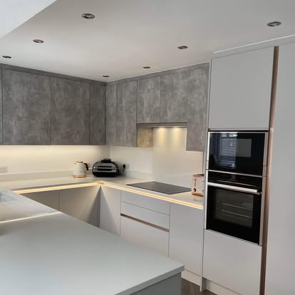 Contemporary kitchen with grey and white cabinetry